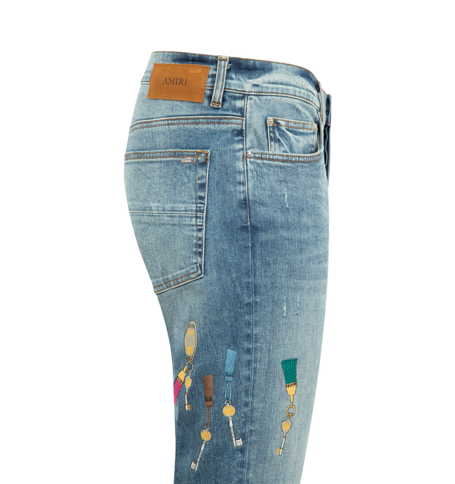 Image 3 of 3 - BLUE - AMIRI Chateau Keys MX1 Jean in Italian stretch denim featuring 5 pocket style, repaired with pleated ultrasuede and embroidered with seasonal logo graphics. 92% cotton, 6% elastomultiester, 2% elastane. Made in United States.