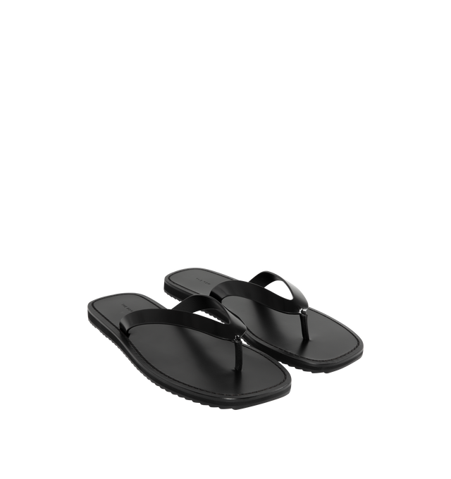Image 2 of 4 - BLACK - THE ROW City Flip Flop featuring refined flip flop sandal in glossy calfskin leather with contrast leather footbed, stitched detailing, and lightly treaded rubber sole. 100% calfskin leather. Made in Italy.