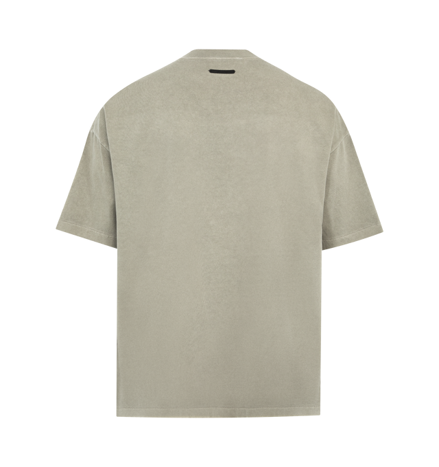 Image 2 of 2 - NEUTRAL - FEAR OF GOD ESSENTIALS Training 90s Tee featuring heavyweight cotton jersey, pigment dyes, a 90s fit with oversized proportions and dropped shoulders, puff-printed Fear of God Essentials training graphic, rib-knit crewneck and Essentials signature label at the back neckline. 100% cotton.