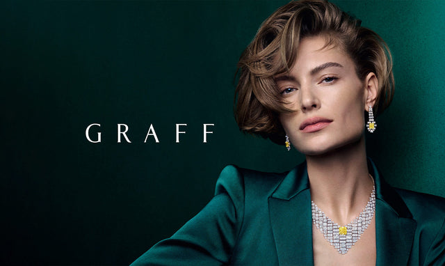 Woman wearing Graff diamond necklace and earrings