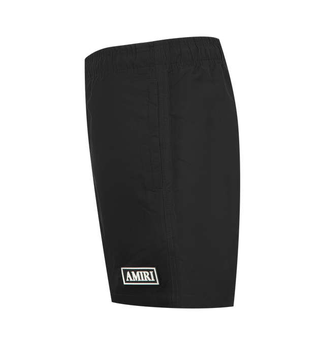 Image 3 of 3 - BLACK - AMIRI Patch Swimshort featuring classic fit, side seam pockets, elastic waistband with drawcord and AMIRI logo at front. 100% polyester. Made in Italy.