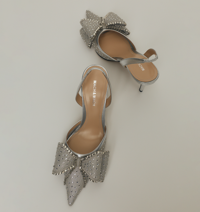 Image 2 of 5 - SILVER - MACH MACH Le Cadeau Crystal Mesh Slingback featuring an elasticated slingback strap, a high stiletto heel, crystal embellishments and bow detailing. The heel height measures 85mm. Made in Italy.