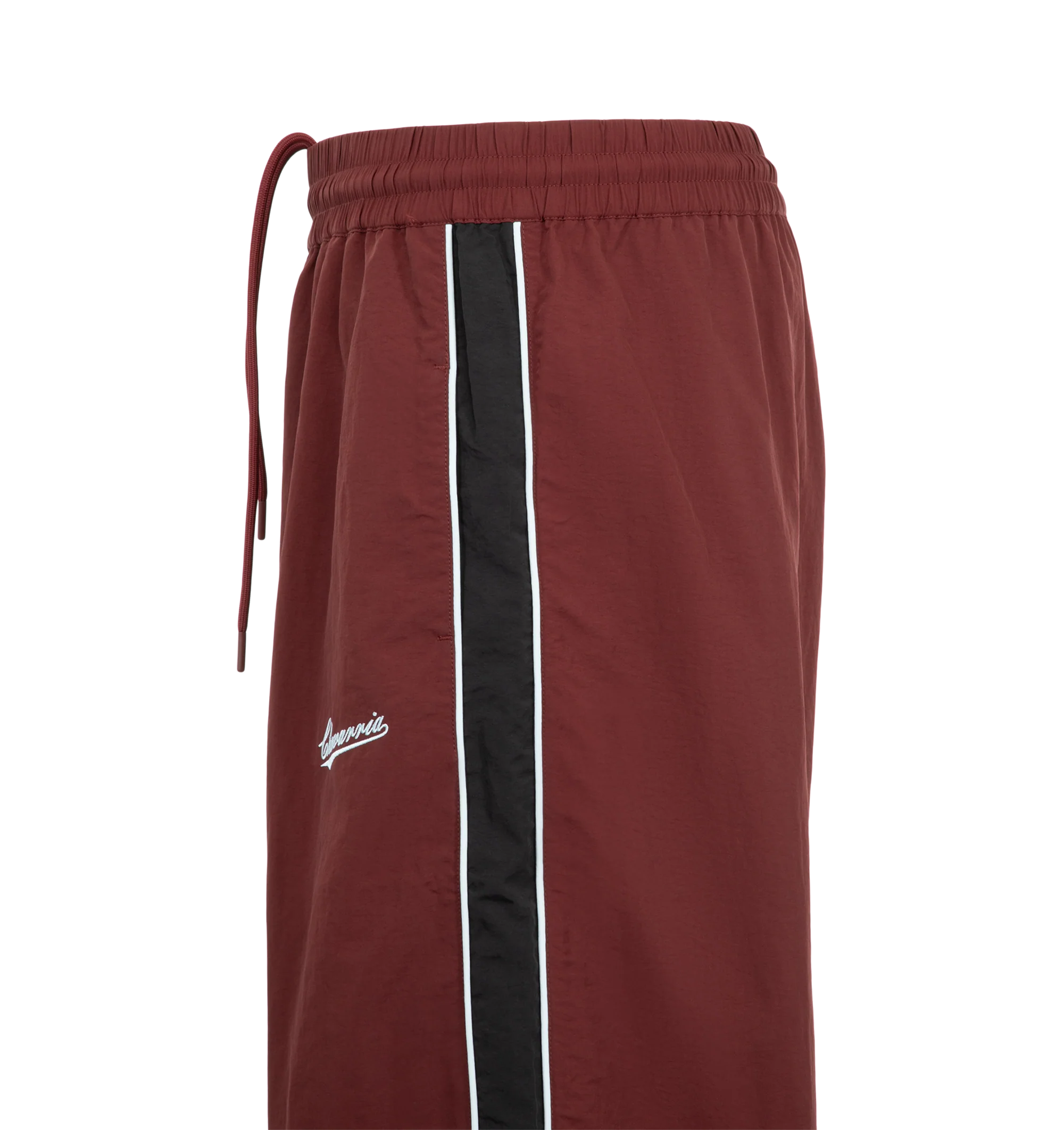 Image 3 of 3 - RED - Willy Chavarria Bad Boy Track Pant is crafted from lightweight nylon and features a relaxed athletic silhouette with an elasticated waistband and cuffs. Designed with a concealed drawstring waist, two seam pockets, embroidered logo detailing, and contrast piping along the outseams, the pant delivers the brand's bold sportswear-inspired aesthetic. Main Material: 100% Nylon.  