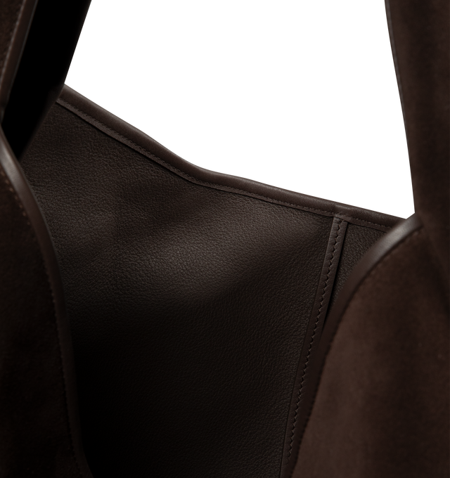 Image 3 of 3 - BROWN - Loewe Mens Roomy Hobo Bag is crafted from suede calfskin. Features a tactile construction that naturally conforms to the body, discreetly embossed archive-inspired LOEWE logo, shoulder carry, strap closure, leather piping, unlined interior, and detachable zipped pouch with calfskin puller. Main Material: Suede Calfskin. Dimensions: 46cm W x 41cm H x 19cm D; Handle Drop: 20cm. Made in Spain.