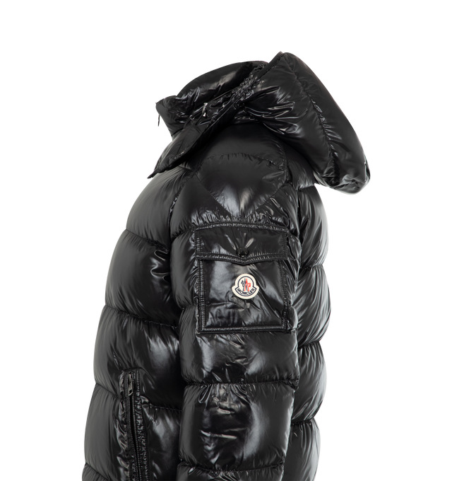 Image 4 of 4 - BLACK - MONCLER Maya Jacket featuring nylon laqu lining, down-filled with boudin quilting, detachable hood with snap buttons, adjustable with drawstring fastening, two-way zipper closure, zipped pockets, adjustable, elasticized cuffs with snap buttons, hem with drawstring fastening, flap patch pocket on sleeve and felt Moncler logo on sleeve. 100% polyamide/nylon. Padding: 90% down, 10% feather.