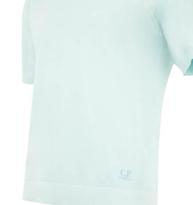 Image 3 of 3 - BLUE - C.P. COMPANY Cotton Crepe Short Sleeve Polo Sweater featuring ribbed open collar and bottom sleeves, armholes with contrast stitching, hem printed logo, gauge 14 and regular fit. 100% cotton. Made in Italy.