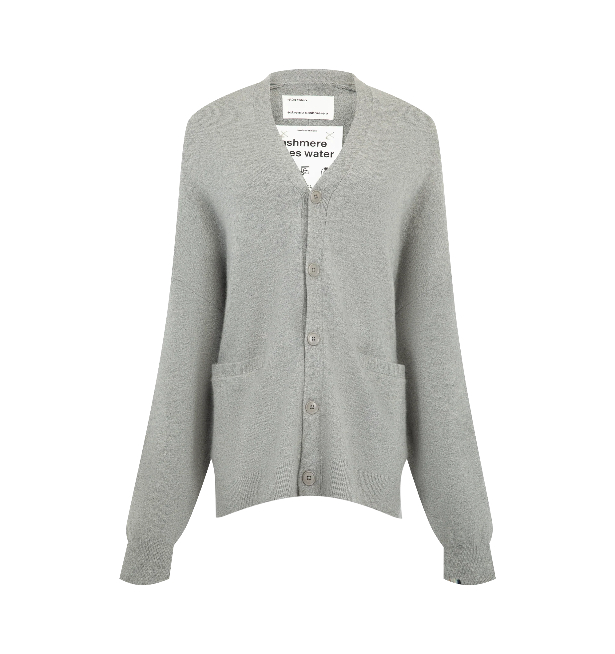 Image 1 of 2 - GREY - Extreme Cashmere Women's N24 Tokio Cardigan Sweater is crafted from a premium cashmere blend and features a relaxed silhouette with dropped shoulders, two front patch pockets, and a unique side button that allows for adjustable styling. This designer cashmere cardigan combines exceptional softness with versatile functionality, while durable natural corozo buttons add a refined finishing touch. Main Material: 88% Cashmere, 10% Nylon, 2% Elastane.