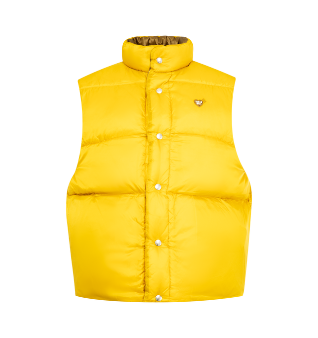 Image 3 of 3 - YELLOW - HUMAN MADE Reversible Down Vest featuring nylon ripstop fabric with down and feather filling, lightweight material with a shiny appearance, reversible design combines dark and light colors, dark-toned side features a duck name tag, light-toned side has a heart patch, quilt stitching forms a heart on the back, both sides have two front pockets and logo snap button closure. 100% nylon.