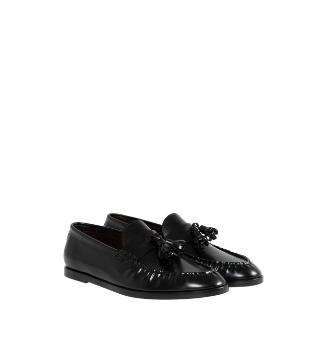 Image 2 of 4 - BLACK - THE ROW Loafer featuring sleek calfskin leather with natural pleating effect and tassel detailing. 100% leather. Made in Italy.