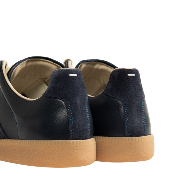 Image 3 of 5 - NAVY - MAISON MARGIELA High Quality Luxury Sneakers featuring lace-up sneakers in buffed nappa calfskin and calfskin suede, contrasting sole, Maison Margiela logo label on the tab, internal High Quality Luxury label, internal elastic and all-over Maison Margiela logo insole. 100% calf leather. Sole: 100% rubber. Made in Italy.
