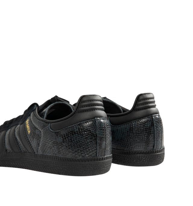 Image 3 of 5 - BLACK - Adidas Men's Samba OG Snake-Effect Sneakers are crafted from calf leather. Features a snake-effect finish, round toe, lace-up closure, signature 3-Stripes, logo-print tongue, branded heel counter, and flat rubber sole. Upper: Calf Leather; Lining: Calf Leather; Sole: Rubber. Made in Cambodia. 