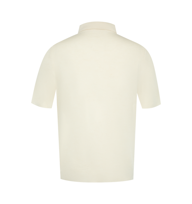 Image 2 of 2 - WHITE - THE ROW Ravi Top featuring short-sleeved polo top in silk, cashmere, and linen with classic fit and front button closure. 60% silk, 30% cashmere, 10% linen. Made in Italy.