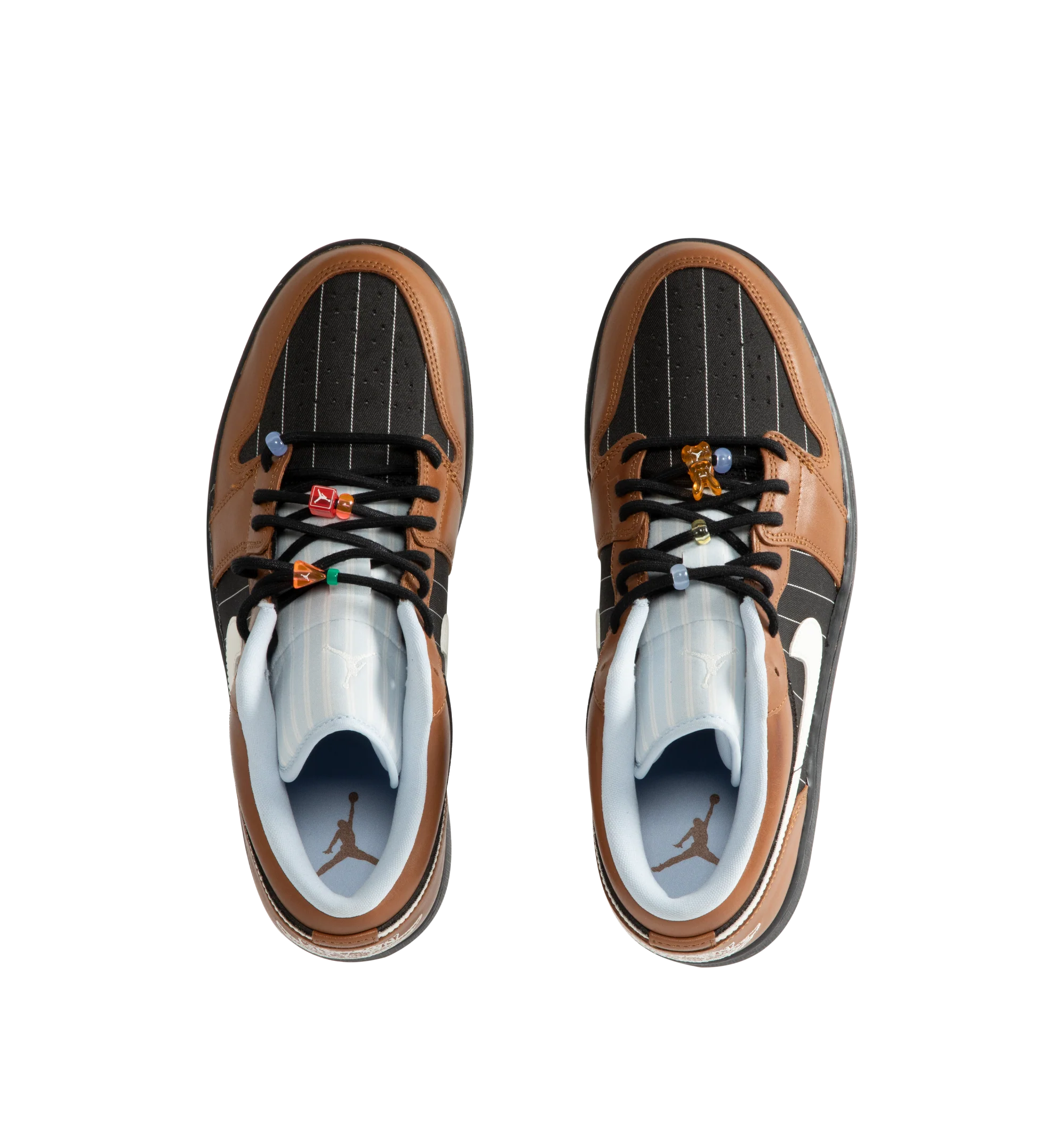 Image 5 of 5 - BROWN - Men's Air Jordan 1 Low SE Sneakers feature a genuine leather and suede upper with the iconic low-top silhouette, signature Wings branding, and a Jumpman logo for a premium take on a timeless classic. These lifestyle sneakers combine encapsulated Air-Sole cushioning with a durable rubber outsole for lightweight comfort, lasting support, and reliable everyday traction. Main Material: Genuine Leather and Suede. Midsole: Encapsulated Air-Sole Unit. Sole: Rubber.