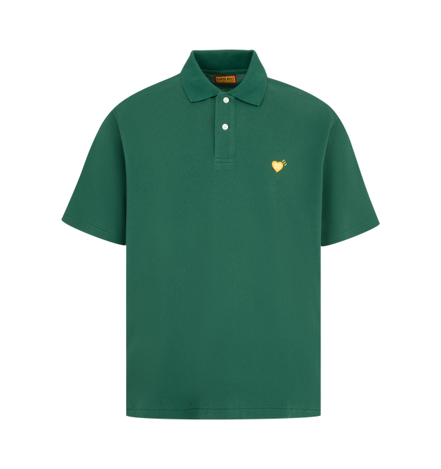 Image 1 of 2 - GREEN - HUMAN MADE Polo Shirt featuring a wide fit, single heart patch on the left chest, short sleeves, polo collar and shell-like buttons with the brand logo. 100% cotton. Made in Japan.