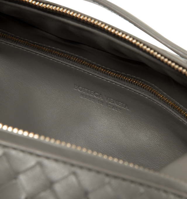 Image 3 of 3 - GREY - BOTTEGA VENETA Intrecciato Handbag featuring double top handles, detachable strap, structured design, one main compartment, one flat zip pocket, intrecciato leather and zip closure. Calf leather. Made in Italy. This item may be restricted for online purchase to international clients. For assistance purchasing this item please contact our dedicated stylist team at personalshopping@hirshleifers.com.