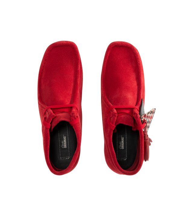Image 4 of 4 - RED - CLARKS Wallabee Boot featuring a rich red suede upper with hand-stitched apron seams, classic moccasin construction, two exclusive FOBs, amber pebble crepe sole, woven sock label and red tassels. 