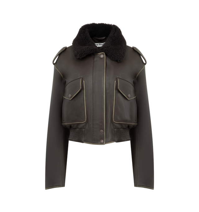 Image 1 of 5 - BROWN - ACNE STUDIOS Leather Bomber Jacket featuring soft lamb leather with a shearling collar, dropped shoulders with epaulettes, front flap pockets, side welt pockets, an elasticated hem, front snap button, zipper closure, zip sleeves, a metal logo plaque at the back neckline, relaxed fit and below-waist length. 100% Lamb leather. 100% Lamb shearling. Lining: 100% viscose.