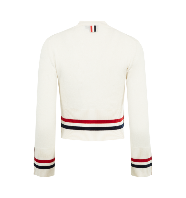 Image 2 of 3 - WHITE - THOM BROWNE Cashmere RWB Stripe Shrunken Cardigan featuring V-neckline, rront button closure, ribbed buttoned cuffs with RWB grosgrain trim, buttoned side vents with RWB grosgrain trim, ribbed hem, knit RWB tipping at cuffs and hem, signature striped grosgrain loop tab and shrunken fit. 100% cashmere. Made in the United Kingdom.