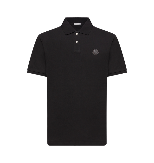 Image 1 of 1 - BLACK - MONCLER Logo Patch Cotton Piquet Polo Shirt featuring cotton piquet, collar with snap button closure, short sleeves, ribbed collar and cuffs and leather logo patch. 100% cotton. Made in Turkey.