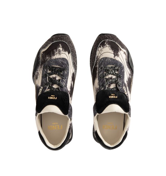 Image 5 of 5 - GREY - FENDI Wave Pulse Sneaker featuring low-top, lace-up closure, technical fabric with a gray graphic print and matching suede inserts, contrasting black cavallino calfskin details, folded tongue, tubular laces, three-dimensional rubber logo on the side, gold-colored metal Fendi logo on the tongue, rubber running sole with wraparound edge on the side and diagonal F motif. 100% calfskin. 100% polyamide. Inside: 100% lamb leather. Made in Italy.