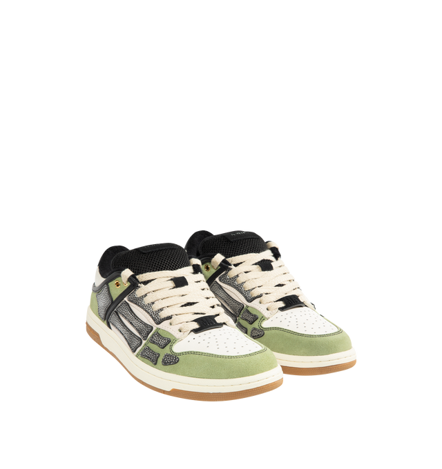 Image 2 of 5 - GREEN - AMIRI XL Skel Low Top Sneaker featuring suede and leather upper with rubber sole, lace-up closure, logo detail at tongue, cushioned collar and mesh tongue, leather bone appliques and perforated toe.