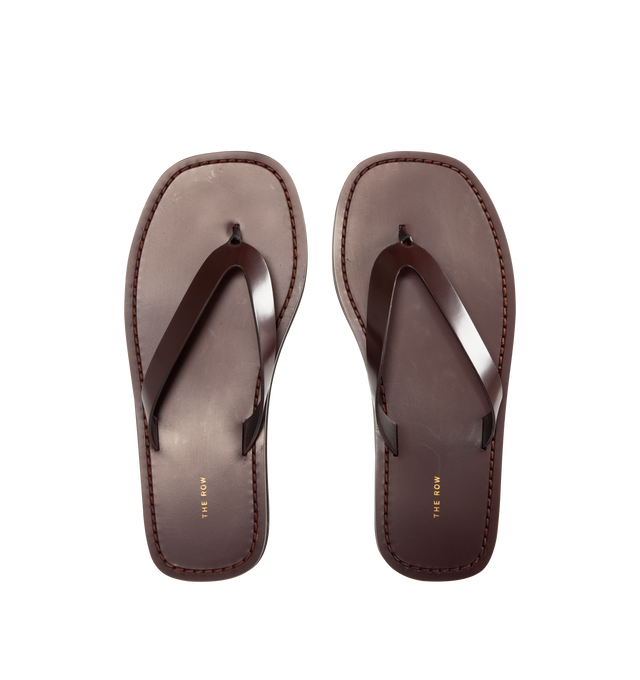 Image 5 of 5 - BROWN - The Row Refined flip flop sandal in shiny calfskin leather with stitched leather detailing and lightly treaded sole. 100% Calfskin Leather. Made in Italy.