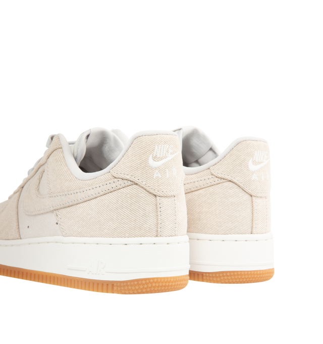Image 3 of 5 - NEUTRAL - NIKE Air Force 1 '07 LV8 'Denim' Sneaker featuring leather upper with a perforated toe box, Nike Air cushioning and rubber outsole with heritage hoops pivot circles. 