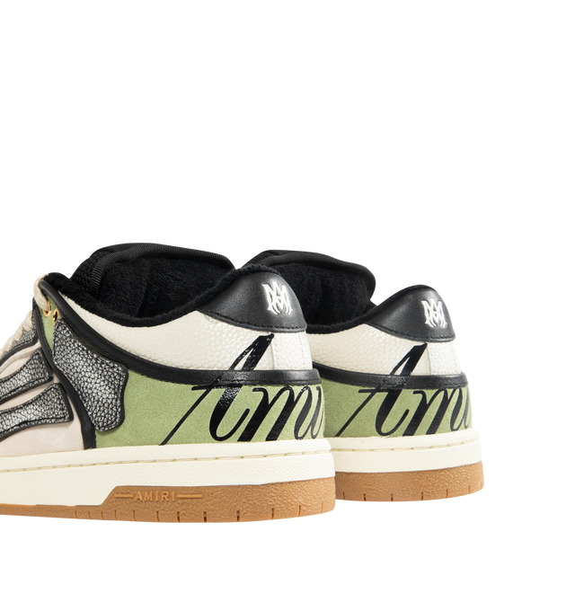 Image 3 of 5 - GREEN - AMIRI XL Skel Low Top Sneaker featuring suede and leather upper with rubber sole, lace-up closure, logo detail at tongue, cushioned collar and mesh tongue, leather bone appliques and perforated toe.