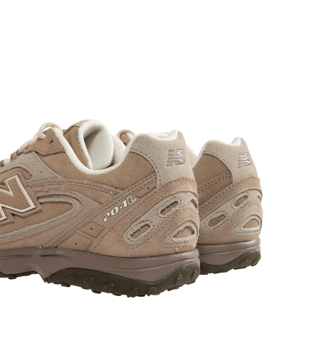 Image 3 of 5 - BROWN - New Balance 204L sneaker featuring a low-profile silhouette, slim structure of '70s running shoes, tech-inspired texture of premium suede, multi-piece upper with embossed overlay, double-stacked suede 'N' logo, and screen-printed graphics along the saddle. Distinctive outsole with 2000s-inspired strike path and 70s-influenced tread pattern. Outer: Calf Suede 100%, Lining: Fabric 100%, Sole: Polyethylene vinyl acetate (PEVA) 100%. Made in Vietnam.