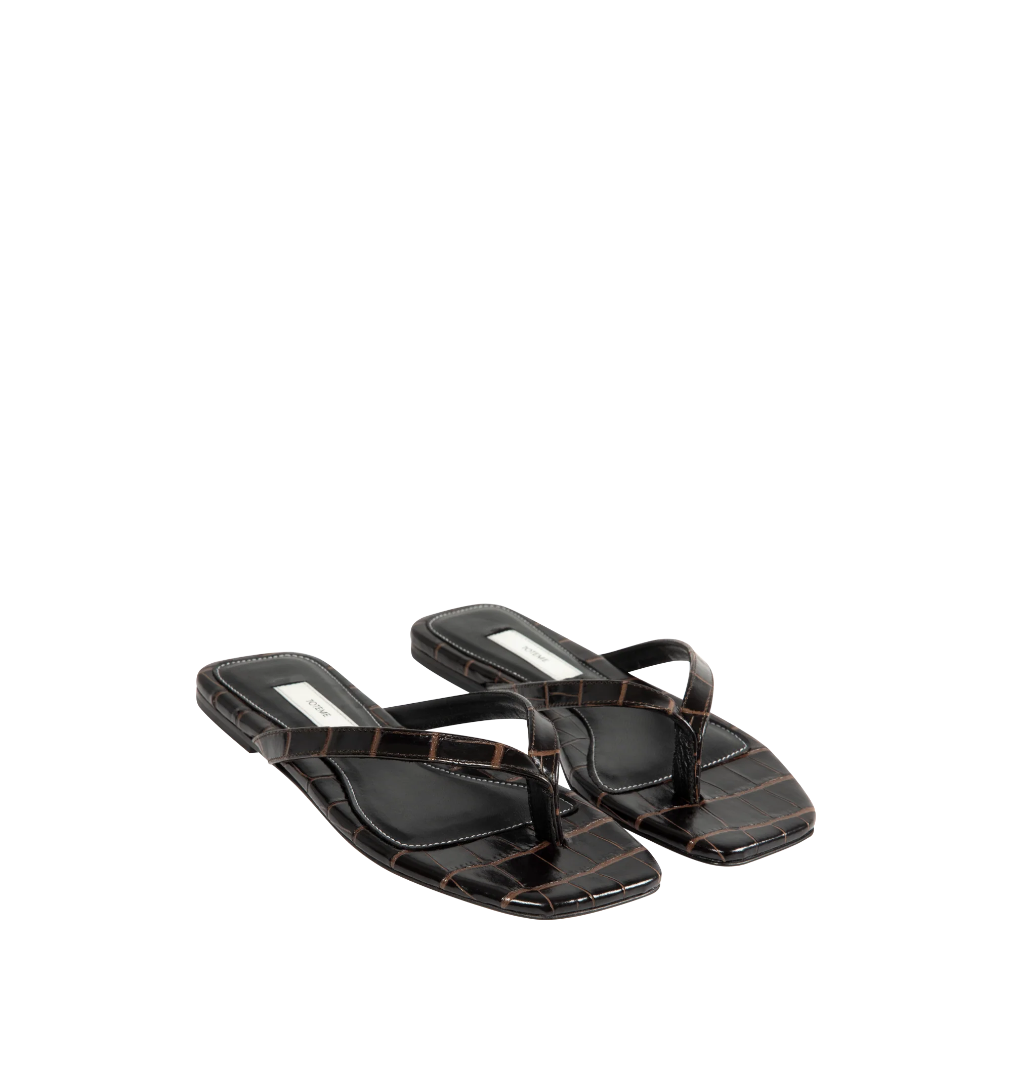 Image 2 of 4 - BROWN - Toteme Women's Croco-Embossed Flip-Flops are crafted from croc-embossed leather and feature a minimalist thong silhouette with an open square toe. Designed with a padded sheepskin footbed featuring a subtle logo patch, these designer sandals are finished with a calfskin leather sole for a refined take on an everyday warm-weather essential. Part of Toteme's Garderob collection. Upper: Leather. Footbed: Sheepskin. Sole: Calfskin Leather. Color: Dark Brown. Made in Italy. 