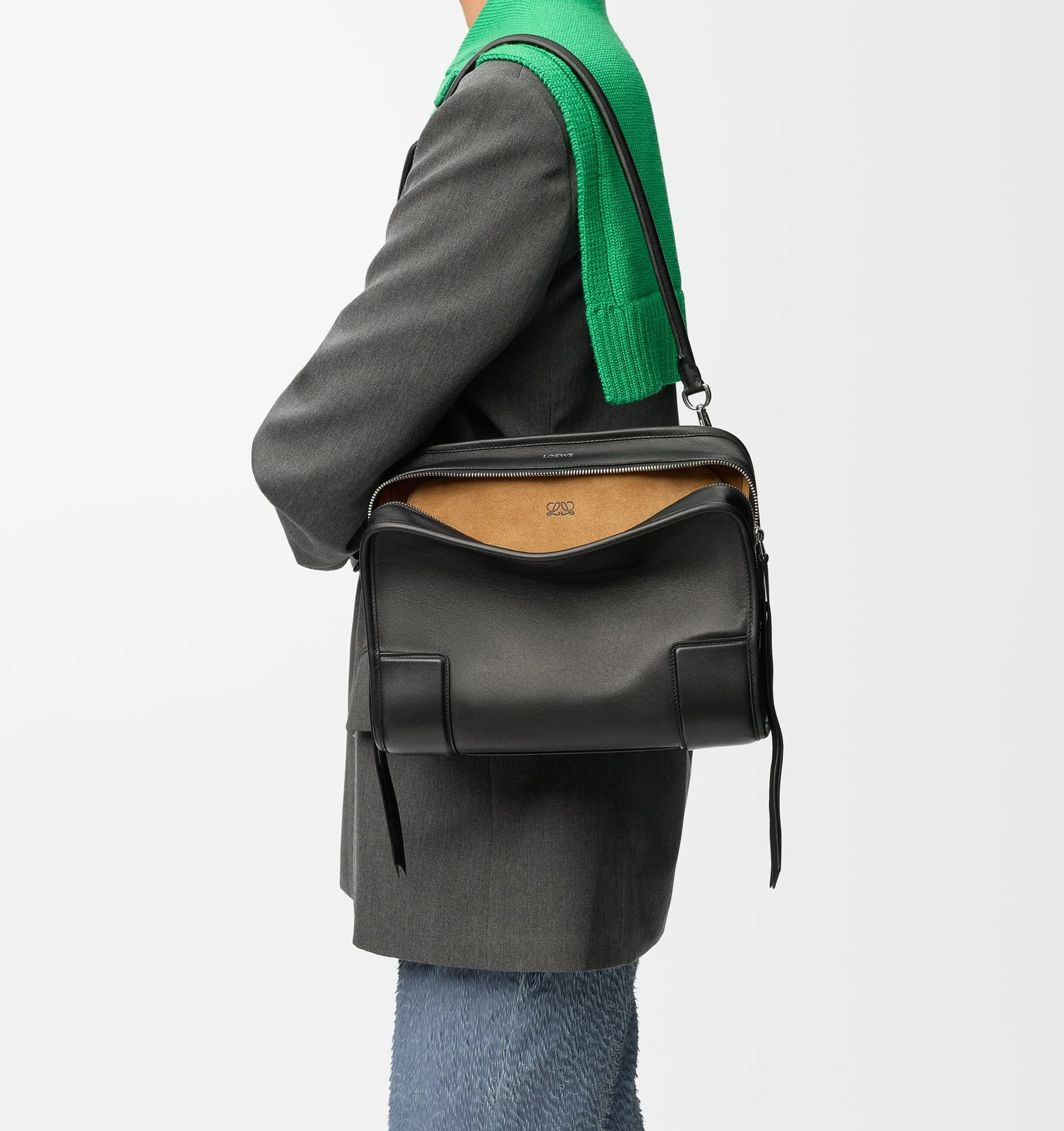 Image 2 of 17 - BLACK - Loewe Amazona Medium 180 Bag in soft calfskin leather featuring a relaxed silhouette with a single toron top handle, designed to be carried open, while a concealed closure secures the main compartment, removable shoulder and crossbody straps, zip closure with two leather zip pullers, two compartments, main compartment closed with magnetic closure, internal flat pocket, suede lining and embossed logo. Soft calfskin. Strap length 108 cm; Strap Drop 50 cm; Handle drop 11 - 28 cm; Height