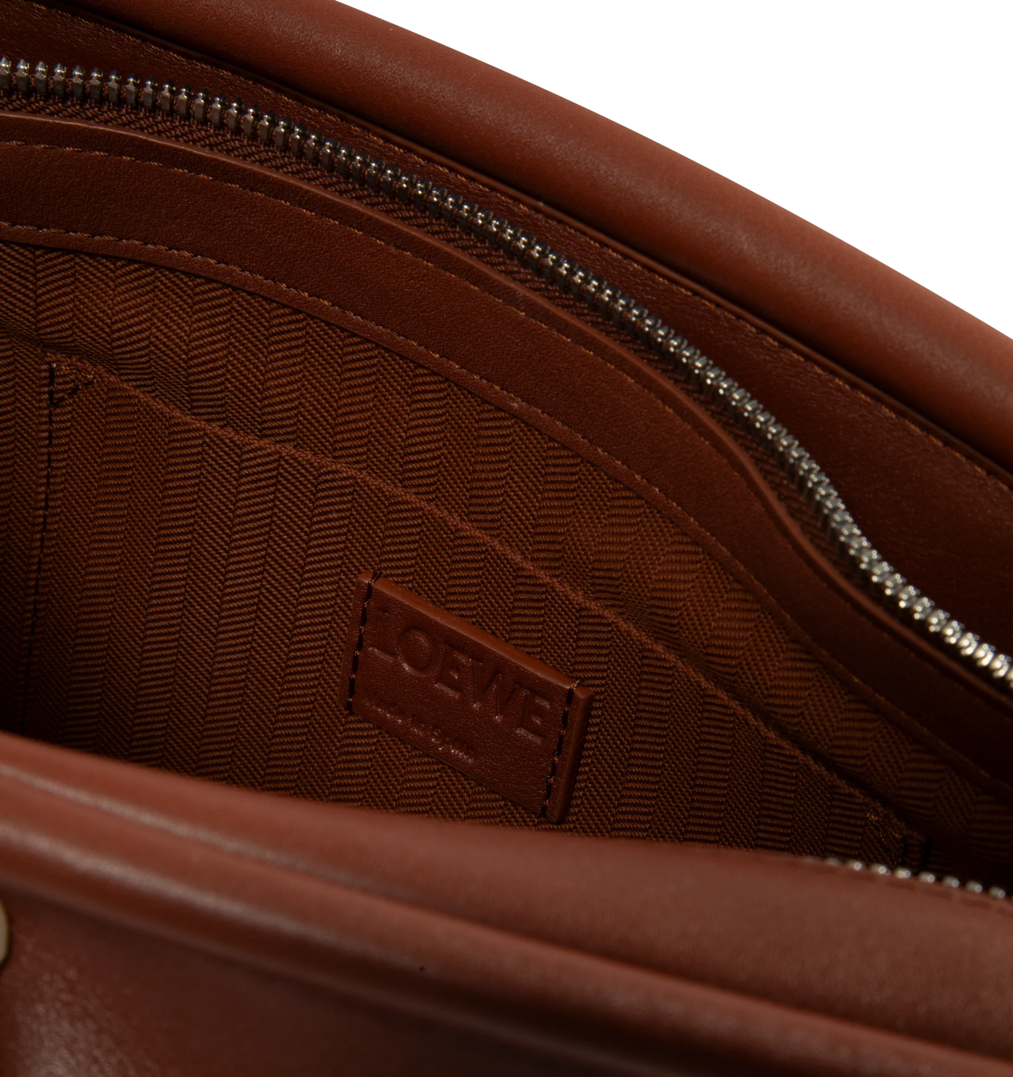 Image 3 of 3 - BROWN - Loewe Small Whisker Bag is crafted from black glazed calfskin and features a slouchy silhouette with a structured handle and oversized zip opening. Designed for shoulder, crossbody, or hand carry, it includes a detachable strap with rotating dog clips, articulated zipper pulls, foldable D-rings, an exterior flat pocket, and an interior flat pocket. Gold-tone hardware and embossed Loewe and Double L branding complete the design. Fits a large phone, small wallet, sunglasses, and keys. M