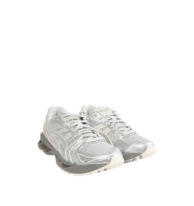 Image 2 of 5 - WHITE - Asics GEL-Kayano 14 Sneakers are lace-up style with rip-stop underlays, GEL cushioning, and TRUSSTIC support system. Unisex style in men's sizing. 
