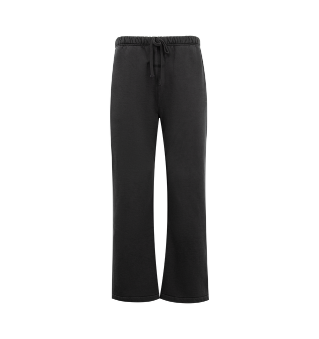Image 1 of 3 - BLACK - FEAR OF GOD ESSENTIALS Signature Classic Flare Sweatpant featuring 520GSM heavyweight fleece, pigment-dyed, relaxed silhouette, flared leg, an encased elastic waistband with elongated drawcords, side-seam pockets, Essentials signature logo embroidered on the leg and an Essentials signature label at the center front. 100% cotton.