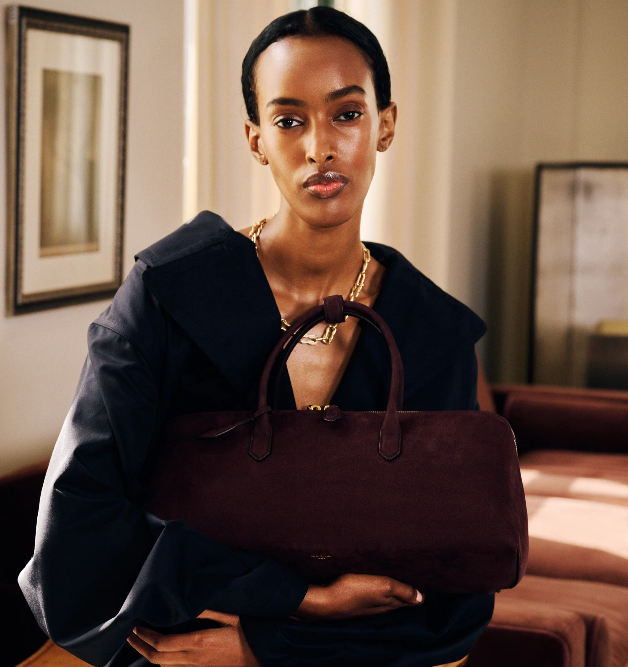 Image 4 of 4 - BROWN - Alaa Women's Delta Medium Bag is crafted from soft nubuck calfskin leather and features a sculptural top-handle silhouette with elongated proportions, clean square lines, a double zip closure, and a front gusset for organized storage. Finished with a decorative branded tie and designed for hand carry, this designer leather handbag showcases Alaa's signature architectural aesthetic with exceptional Italian craftsmanship. Main Material: 100% Calf Leather. Dimensions: 40 x 16 x 15 cm. Fi