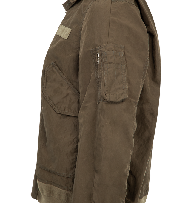 Image 3 of 3 - GREEN - SACAI Treated Nylon Twill Blouson featuring rib-knit hem and cuffs, two-way zip closure, flap pockets at front, utility pocket at sleeve and lined. 100% nylon. Lining: 100% polyester.