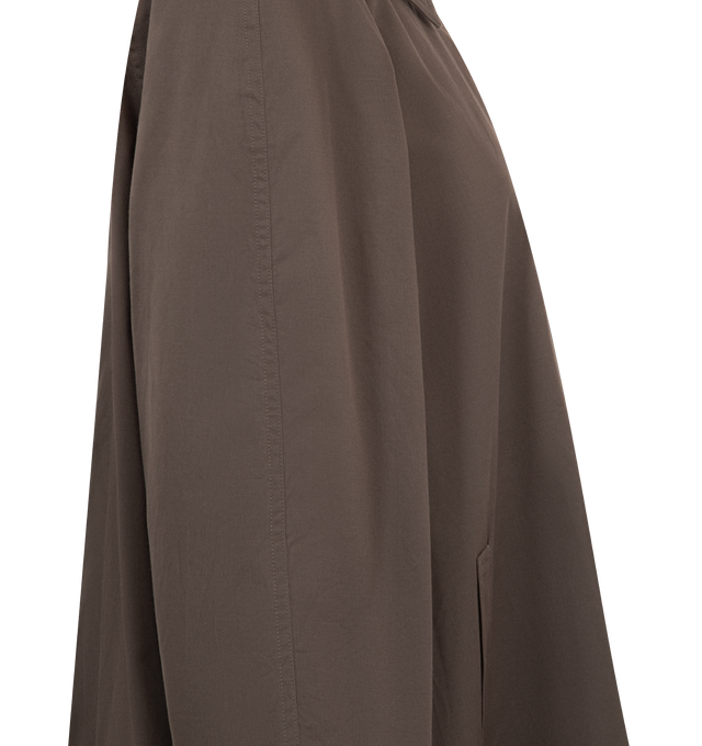 Image 3 of 3 - BROWN - THE ROW Hawkins Coat featuring single-breasted car coat in smooth technical gabardine with relaxed thigh length fit, slightly cropped raglan sleeves, slant went pockets and exposed front button closure. 55% polyester, 45% cotton. Half lined in 100% cotton. Made in Italy. 