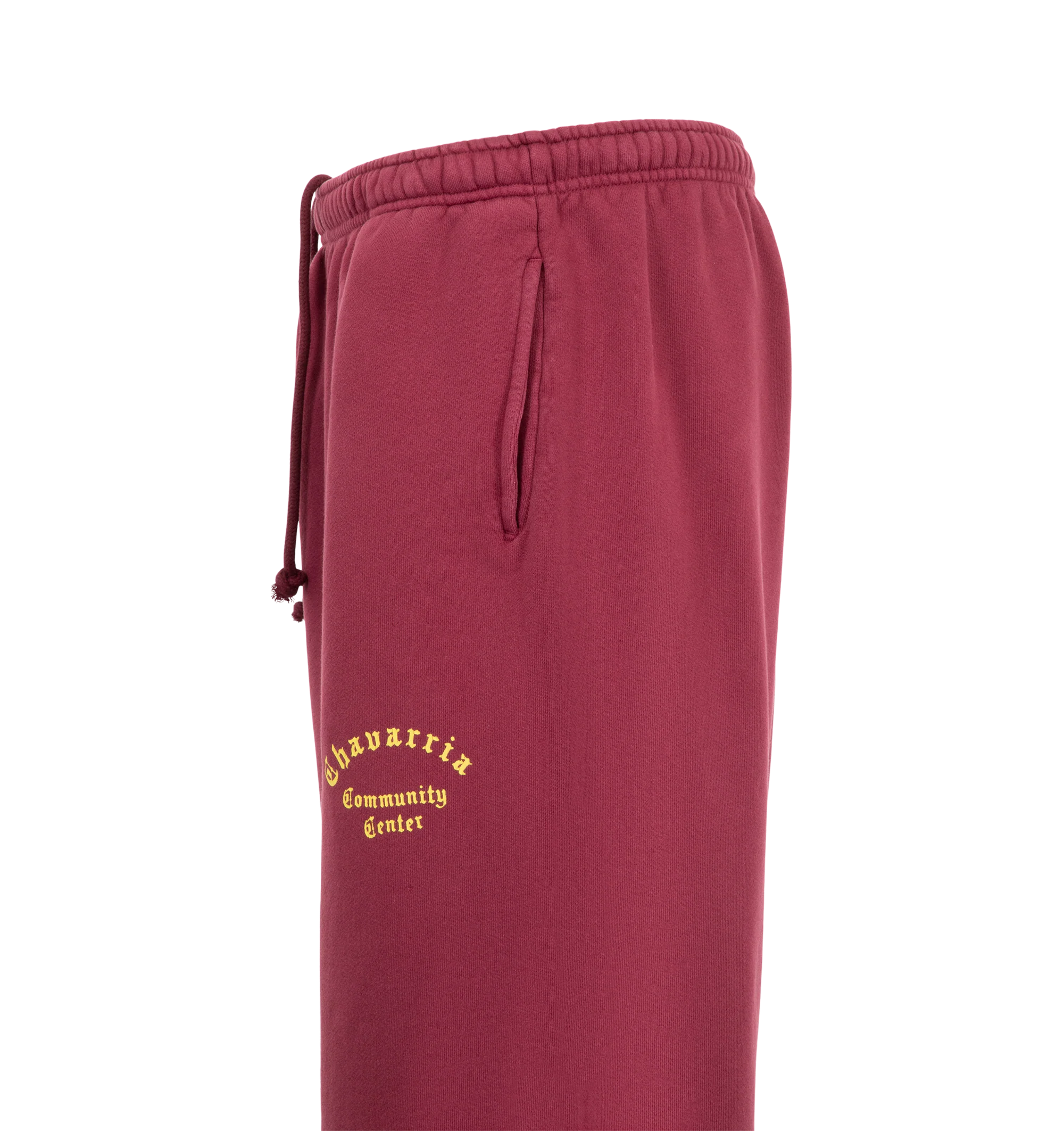 Image 3 of 3 - RED - The Men's Chavarria Community Center Distressed Short is designed with a relaxed, below-the-knee silhouette, an elasticated waistband, and side seam pockets for everyday comfort. Crafted from 100% cotton with raw, distressed hems and finished with a Chavarria Community Center graphic at the leg.