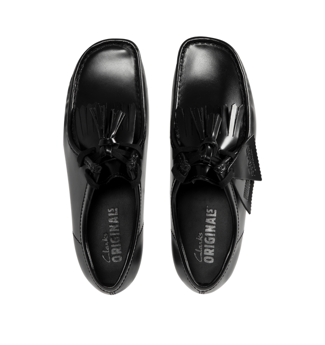 Image 4 of 4 - BLACK - CLARKS Wallabee Hi Shine Leather Shoe featuring dress leather uppers, lace tassels, three FOBS  Clarks Originals, kiltie FOB and 200 years FOB, removable tonal kiltie, natural pebble crepe with a black sole spray, Clarks Originals heat embossed logo on sock, moccasin construction and hand stitched apron seam. 