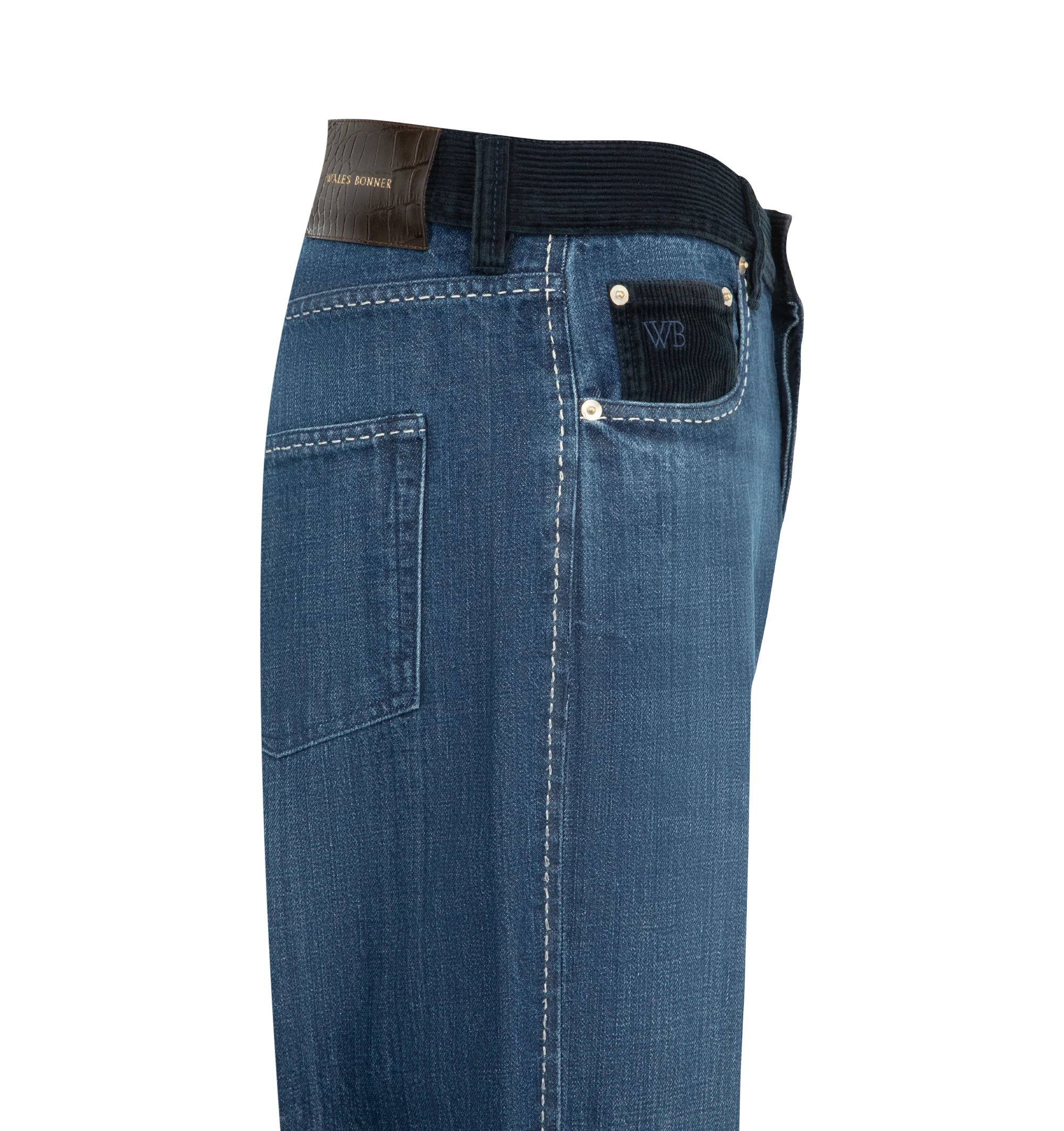 Image 3 of 3 - BLUE - Wales Bonner Men's Studio Jeans are crafted from pure cotton denim and  contrasting corduroy waistband, contrast stitching, and subtle distressed detailing for a lived-in finish. Embroidered branding at the coin pocket and a leather logo patch at the back complete the heritage-inspired design. Main Material: 100% Cotton.  