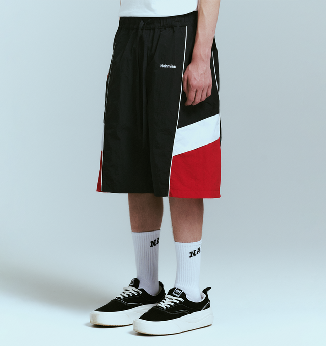 Image 3 of 4 - BLACK - NAHMIAS Warm Up Short featuring ollie wave design, colorblocking, elastic waist with drawstring, embroidered logo, two side pockets and back welt pockets. Nylon.