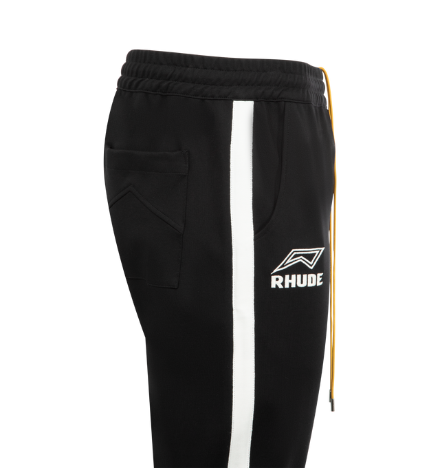 Image 4 of 5 - MULTI - RHUDE Lago Hamptons Track Pant featuring pull-on styling with elastic waistband, 3-pocket styling, front logo detail and midweight jersey fleece fabric. 67% rayon, 28% nylon, 5% spandex. Made in USA.