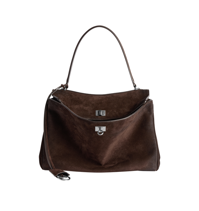 Image 1 of 4 - BROWN - BALENCIAGA Rodeo Handbag Medium in waxed suede calfskin and smooth calfskin featuring one handle, removable shoulder strap, removable cloche cls with two split rings, aged-silver hardware, turn lock closure, wide front pocket, 1 main compartment, 1 inner zipped pocket, 2 flat pockets at back, side snaps, 4 brass feet and nappa lambskin lining. L13.8 x H9.2 x W4.3 inch. Calfskin. Made in Italy.