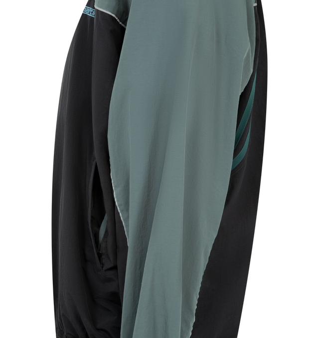 Image 3 of 4 - BLACK - MARTINE ROSE Paneled Nylon Track Jacket with Graphic T-Shirt Lining featuring nylon track jacket prelayered with a peekaboo cotton T-shirt, front zip closure, stand collar, front welt pockets and lined. 100% nylon, with 100% cotton contrast. 