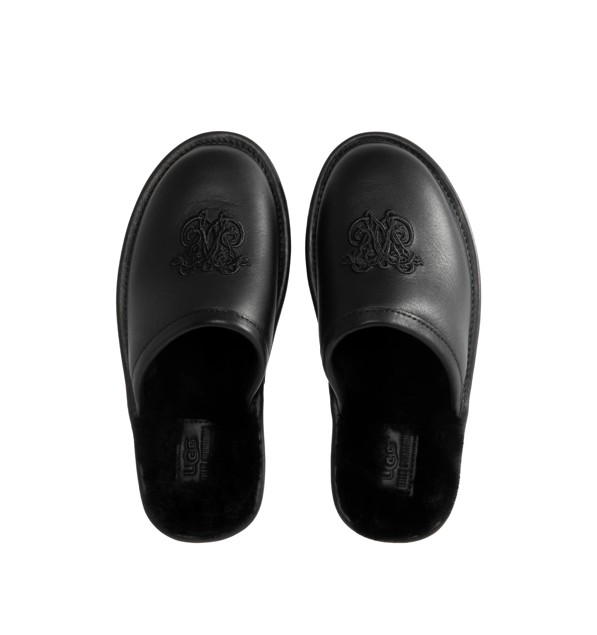 Image 4 of 4 - BLACK - UGG x Willy Chavarria Leather Hotel Slippers are crafted from black leather and feature a luxury reinterpretation of the classic hotel slipper silhouette. Designed with Chavarria's crest embroidered, and lined with UGG's signature plush sheepskin for exceptional comfort. Main Material: Leather. Lining: Sheepskin. Unisex style in men's sizes.