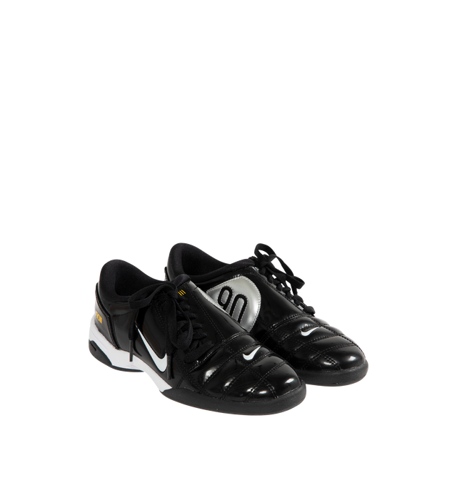 Image 2 of 5 - BLACK - NIKE T90 SP Sneaker featuring authentic soccer style, flat rubber sole, quilted upper, asymmetrical lacing, glossy black and white finish combines with Tour Yellow and Metallic Silver. 