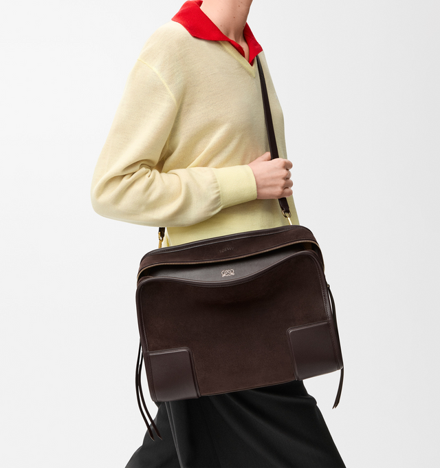 Image 4 of 16 - BROWN - LOEWE Large Amazona 180 Bag in suede featuring a relaxed silhouette anchored by a single toron top handle, designed to be carried open while a concealed closure secures the main compartment, removable shoulder and crossbody straps, zip closure with two leather zip pullers, two compartments, main compartment closed with magnetic closure, internal flat pocket, left side d-ring for customization, suede and nappa lambskin lining, embossed LOEWE and embossed double L branding. Suede/calf.