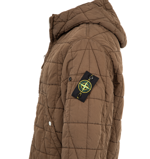 Image 3 of 3 - BROWN - STONE ISLAND Quilted Short Parka featuring padded hood, angled patch hand pockets with snap closure, Stone Island badge at the left sleeve, adjustable cuffs with snap, side tape adjusters at hem and two-way zip fastening. Organic cotton and recycled nylon. 
