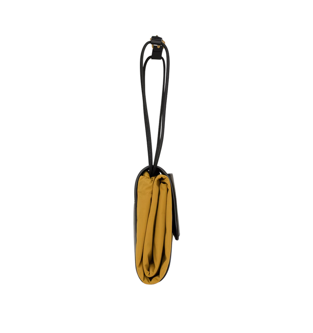 Image 4 of 5 - YELLOW - SAINT LAURENT Foulard Folding Pouch in nylon and leather featuring modular supple pouch with a drawstring carabiner shoulder strap, logo embossed flap with front pocket, viscose lining, bronze-tone hardware, snap-button and drawstring closures, one card slot and one flat pocket at the front. 16.5" x 18.9" x 0.2". Nylon, canvas, calfskin, cotton. Made in Italy.