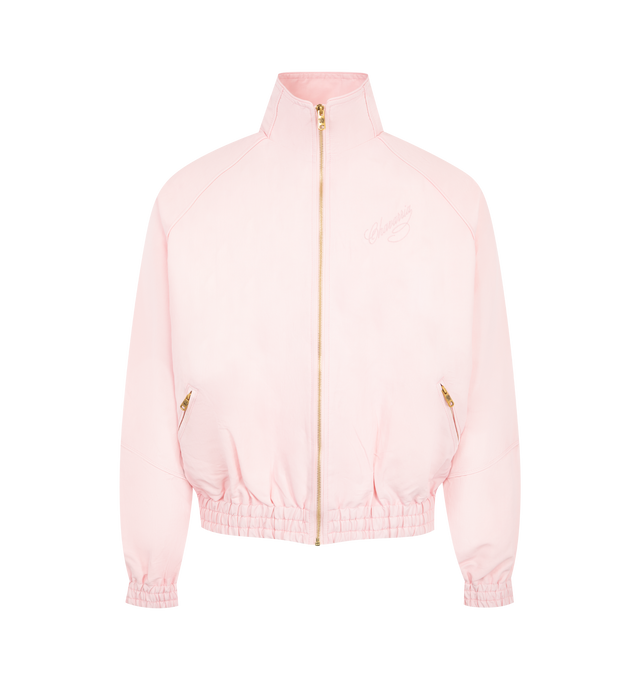 Image 1 of 2 - PINK - WILLY CHAVARRIA Ruff Rider Track Jacket featuring script logo on the front chest, stand collar, golden zip front, long dolman sleeves with elasticized cuffs, side zip pockets, elasticized hem and relaxed cut. Cotton. Made in USA.
